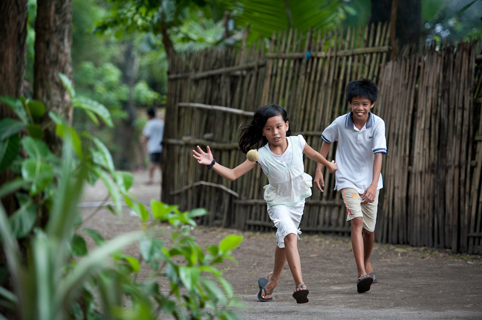 Children playing handball in the street of their barrio.