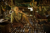 Pala'wan man in home, Philippines.