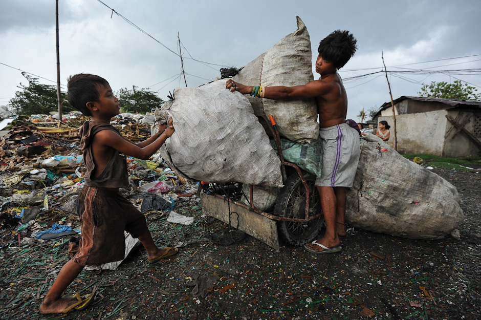 Moving plastic bottles from the Umapad dumpsite.