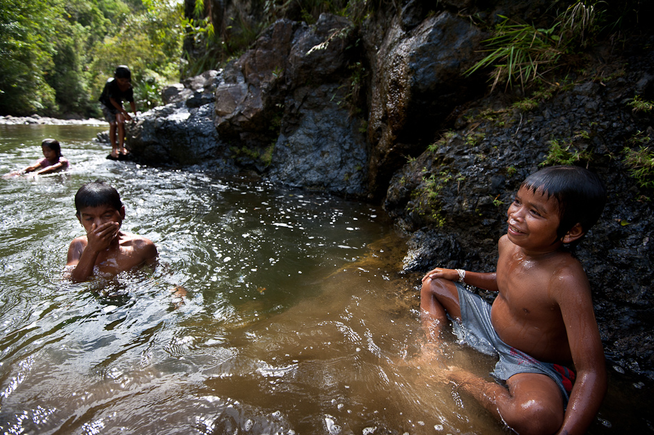 Manobo children playing in a river on their way back from school.