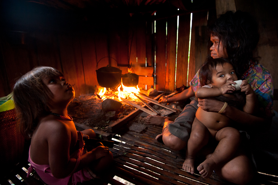 A Manobo family cooking in their home