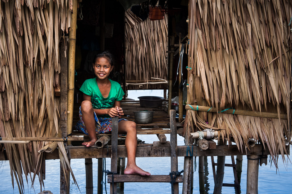 A young Badjao girl in her home. A young Badjao girl in her home.
