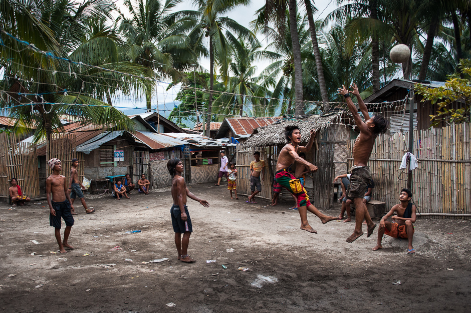 Badjao men playing volleyball Badjao men playing volleyball