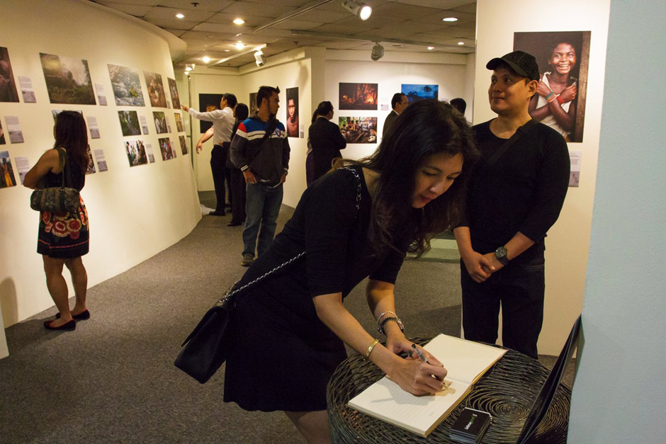 Signing guestbook at opening night.