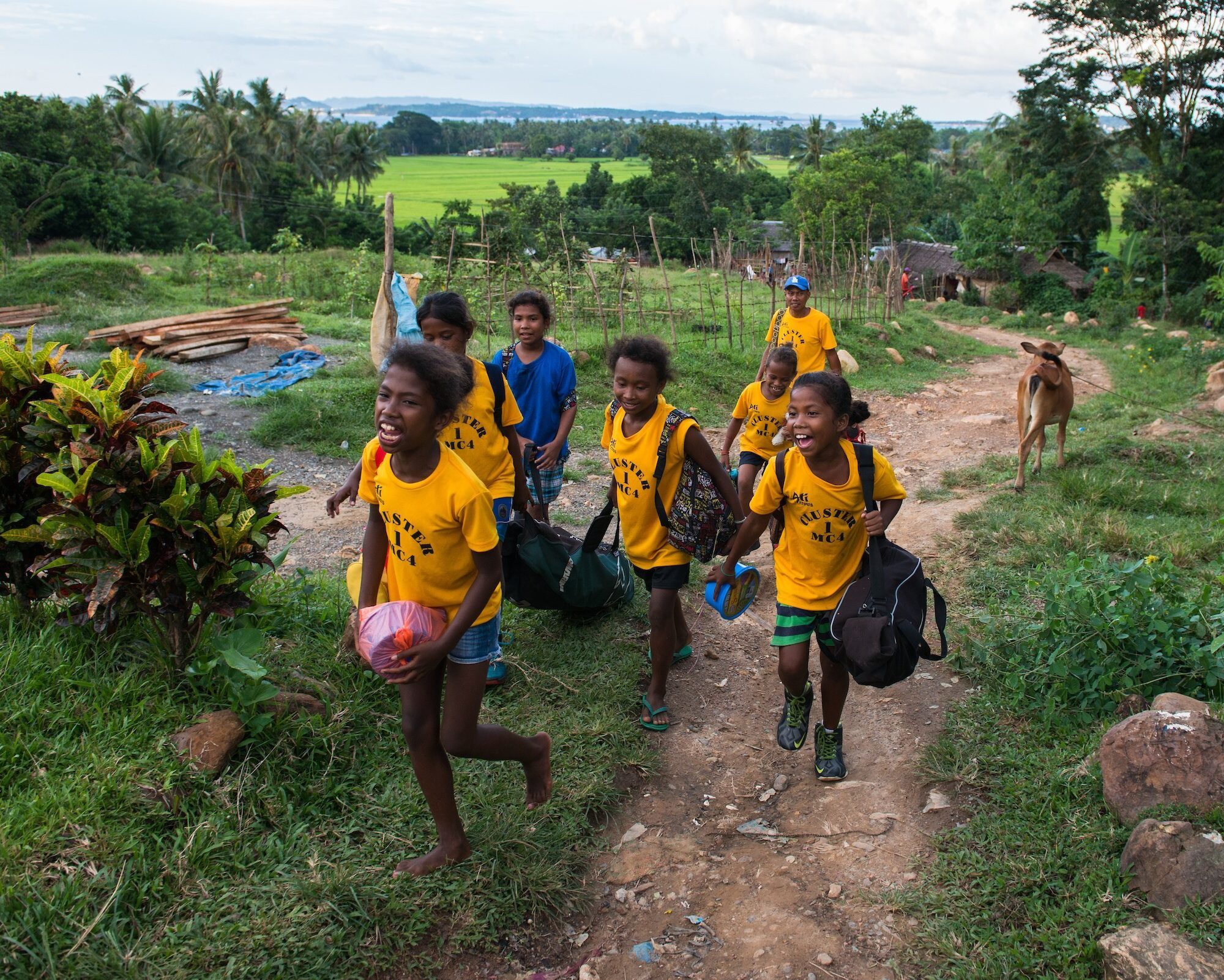 Atis_Panay_5926 Ati girls arrive back in their village after competing in a local softball tournament. Many of the the indigenous Ati are now integrating more into typical Filipino/adapted western culture, especially the younger generation.